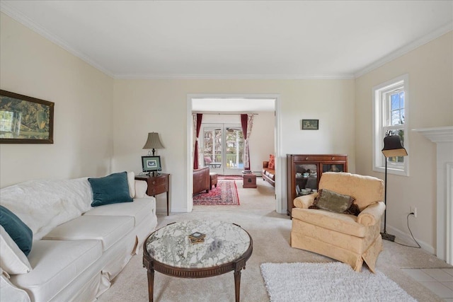 living room with baseboards, ornamental molding, and light carpet