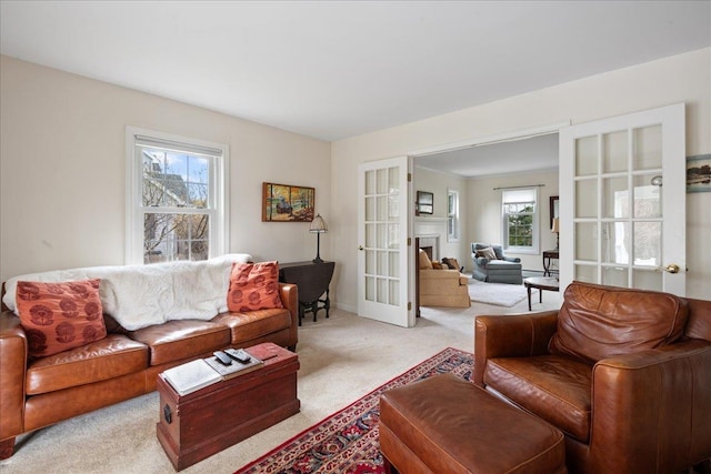 living room with french doors and light colored carpet