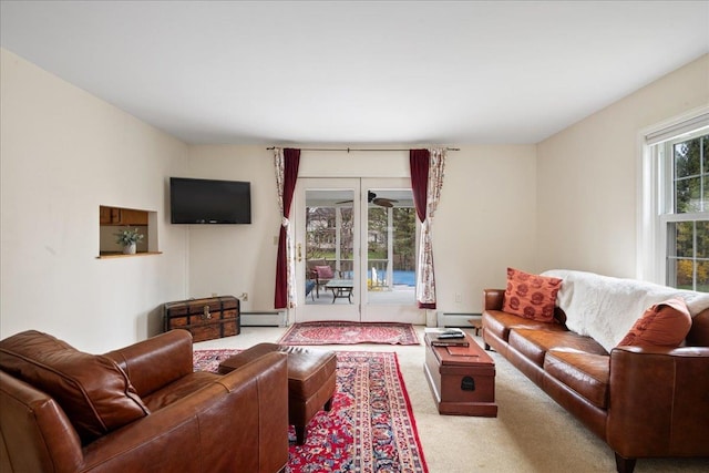 carpeted living area featuring a baseboard radiator and baseboard heating