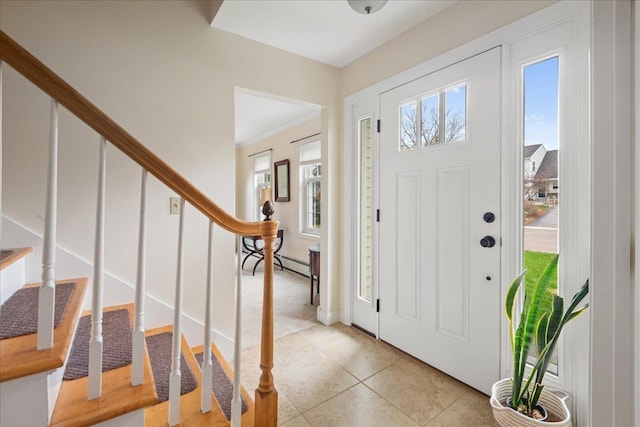 foyer with stairway, baseboard heating, and light tile patterned flooring