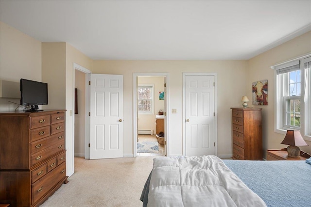 bedroom featuring baseboards, light carpet, and a baseboard heating unit