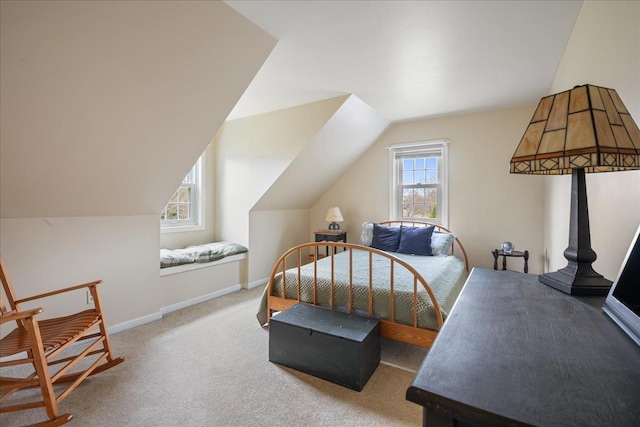 bedroom featuring baseboards, carpet, and vaulted ceiling