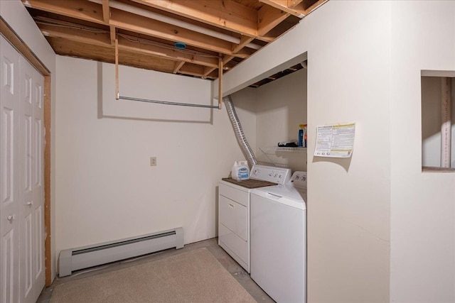 washroom with laundry area, a baseboard heating unit, and washer and clothes dryer