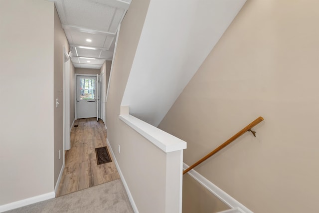 corridor featuring visible vents, recessed lighting, attic access, and an upstairs landing