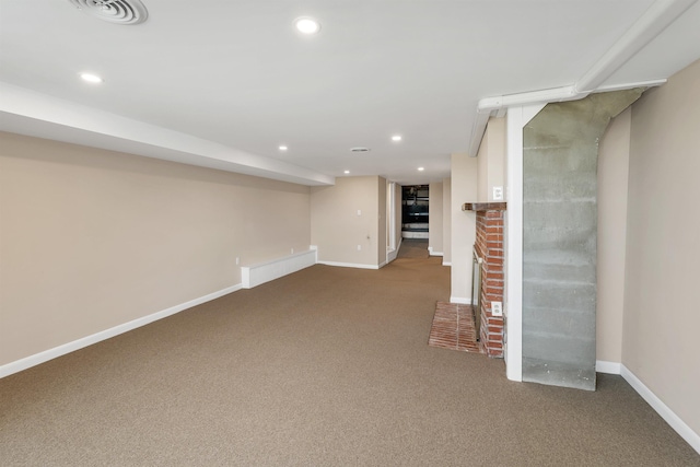 finished basement with carpet flooring, recessed lighting, and visible vents