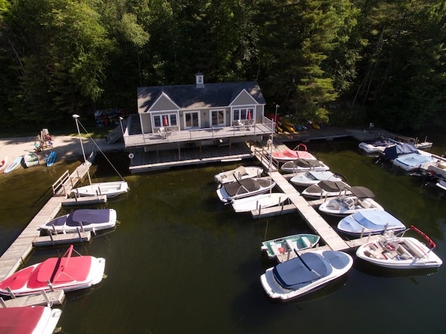 exterior space with a water view and a forest view