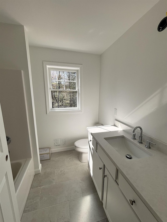 full bath featuring vanity, a shower, toilet, baseboards, and a bathtub