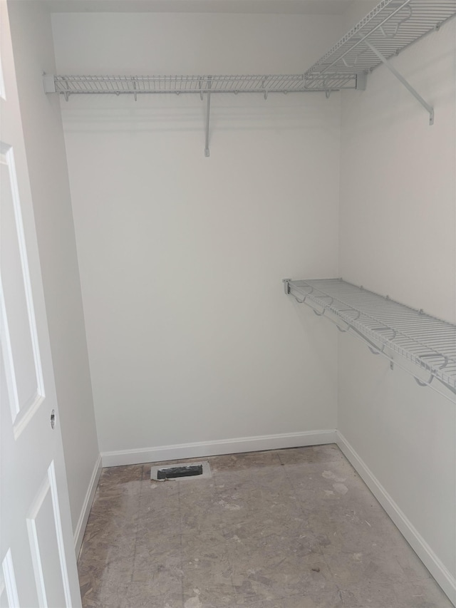 spacious closet featuring visible vents