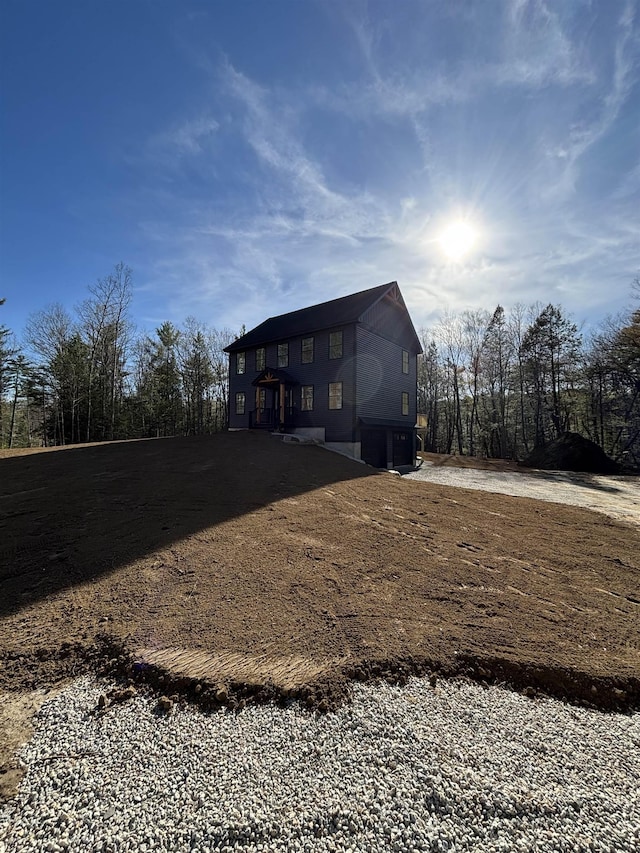 exterior space with dirt driveway