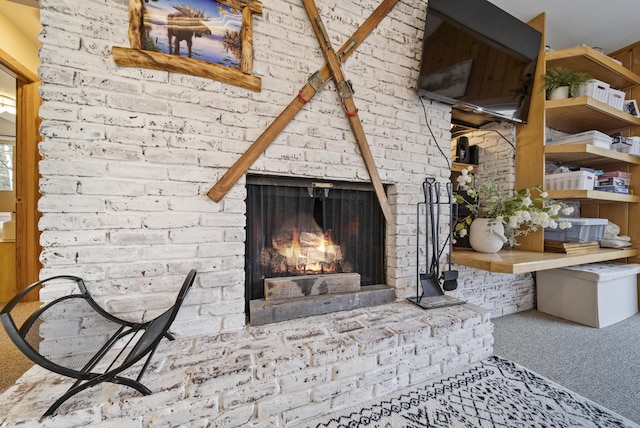 details with carpet floors and a brick fireplace