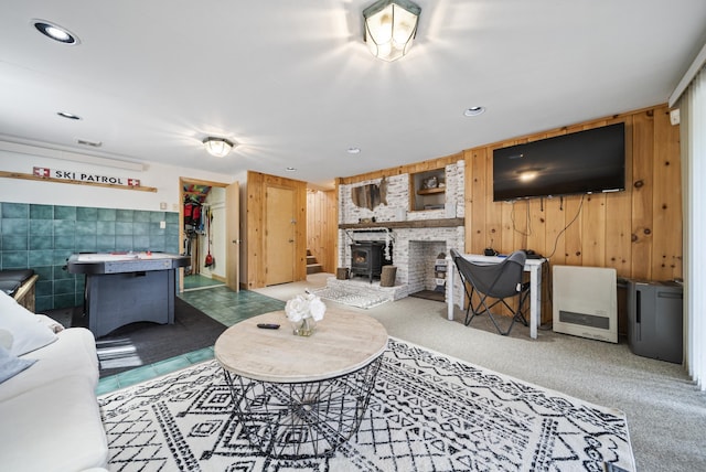 living area featuring recessed lighting and wooden walls