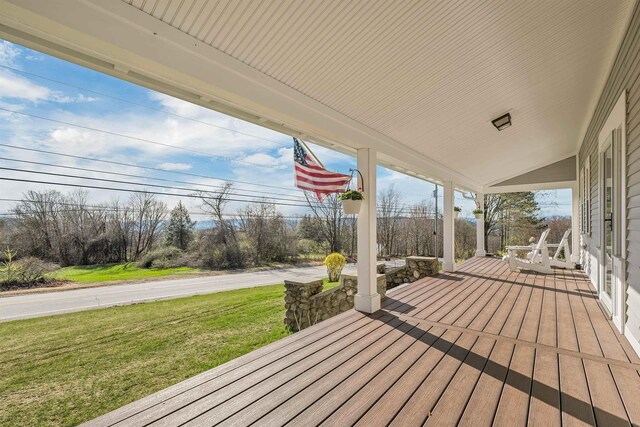 104 Pease Rd, Meredith, NH 03253 - deck with a lawn and covered porch