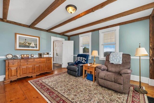 104 Pease Rd, Meredith, NH 03253 - sitting room featuring beamed ceiling, baseboards, and hardwood / wood-style flooring