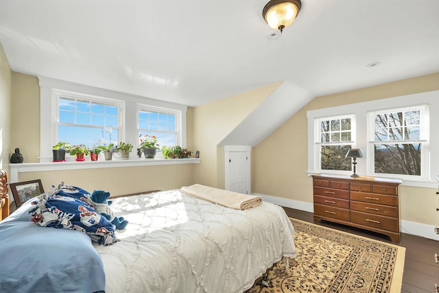 104 Pease Rd, Meredith, NH 03253 - bedroom featuring baseboards, wood finished floors, and multiple windows