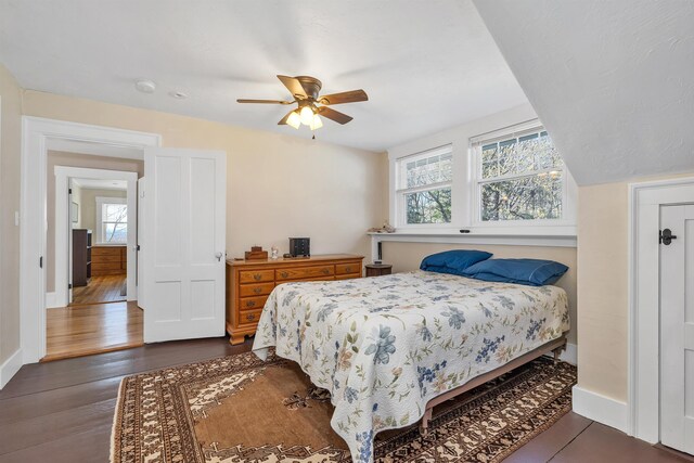 104 Pease Rd, Meredith, NH 03253 - bedroom featuring baseboards, a ceiling fan, and dark wood-type flooring