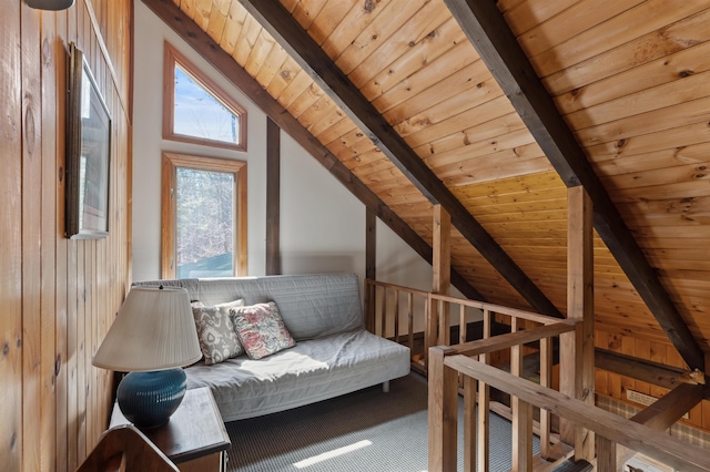 interior space featuring wood ceiling, lofted ceiling with beams, and carpet floors