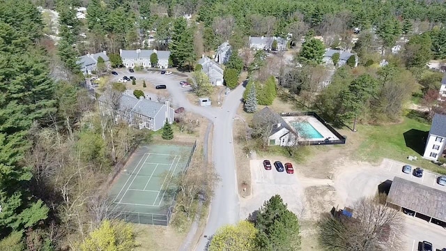 drone / aerial view featuring a forest view