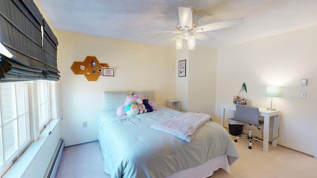 bedroom featuring carpet flooring, ceiling fan, baseboards, and baseboard heating