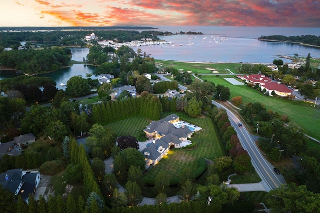 aerial view at dusk with a water view