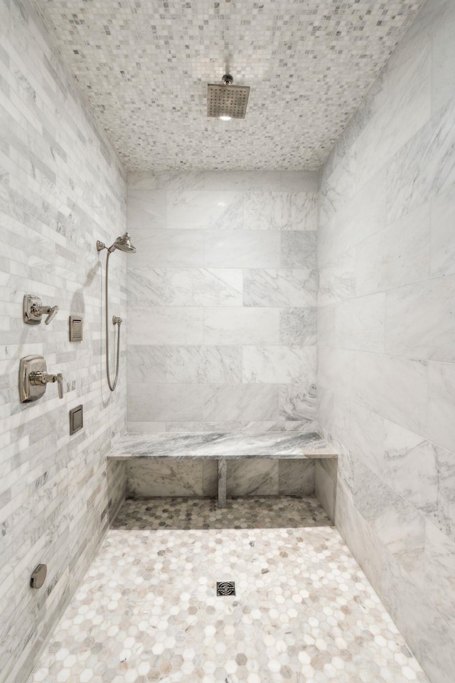 full bathroom with a tile shower