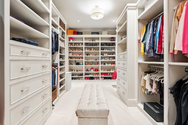 walk in closet featuring carpet floors