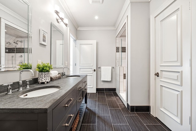 bathroom featuring double vanity, baseboards, a sink, and a stall shower