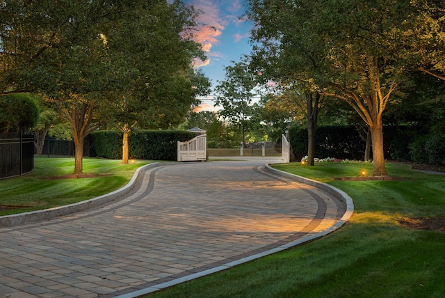 surrounding community with a lawn and fence