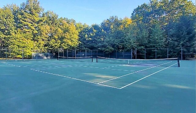 view of sport court with fence
