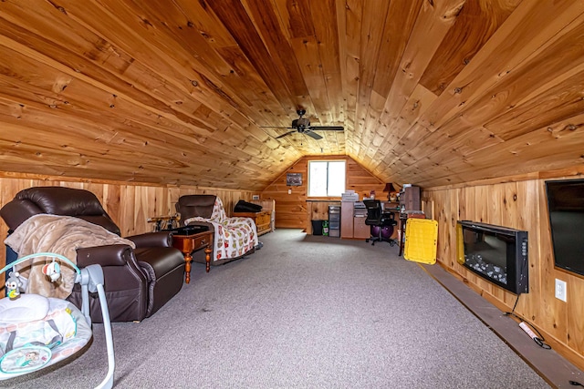 sitting room with carpet floors, wood walls, wooden ceiling, and lofted ceiling