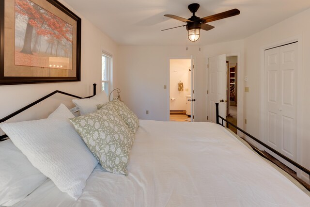 bedroom featuring a ceiling fan, ensuite bathroom, and a closet