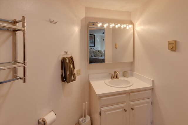 bathroom featuring connected bathroom and vanity