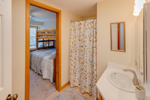 ensuite bathroom with vanity, ensuite bathroom, and a shower with curtain
