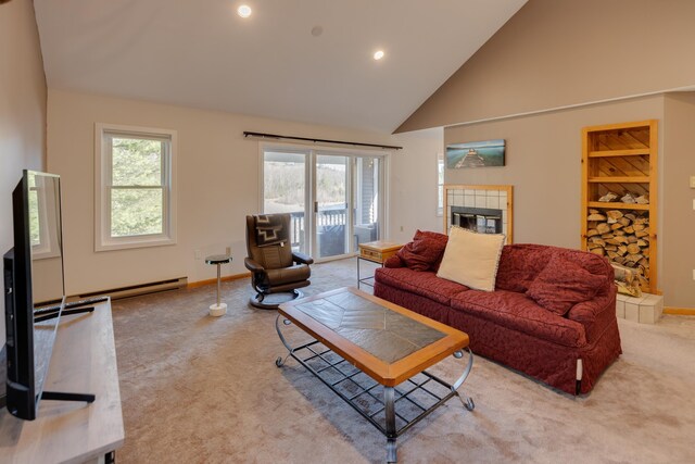 living area with carpet floors, high vaulted ceiling, recessed lighting, baseboards, and a tile fireplace