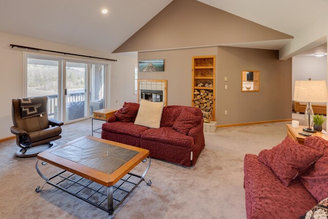 living area with a fireplace, light carpet, baseboards, high vaulted ceiling, and recessed lighting