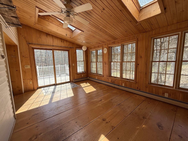 unfurnished sunroom with a skylight and a healthy amount of sunlight