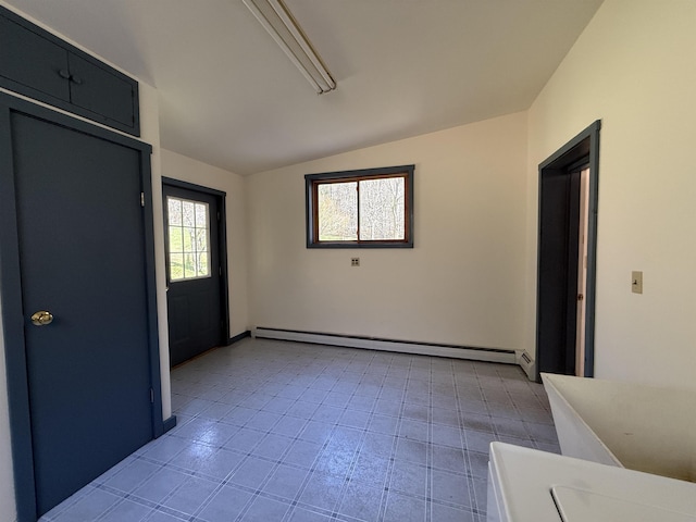 entrance foyer featuring light tile patterned floors, baseboard heating, and vaulted ceiling