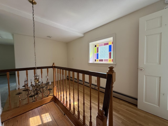 stairway with wood finished floors