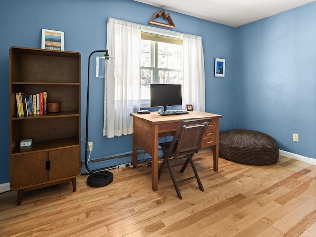 office space featuring light wood-style floors and baseboards