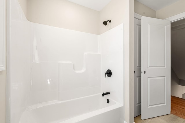 bathroom with bathing tub / shower combination
