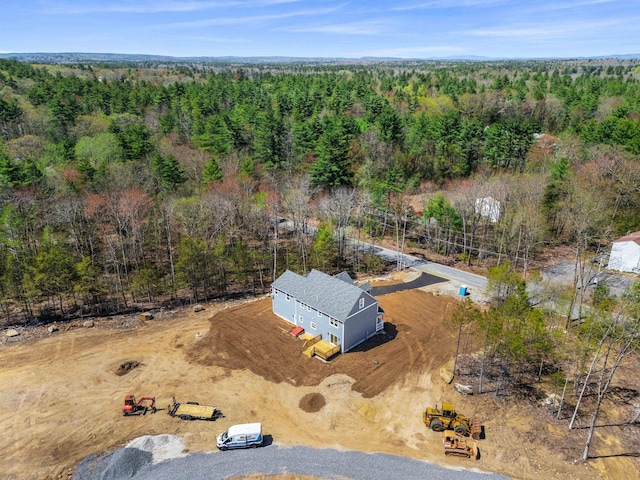 birds eye view of property featuring a view of trees