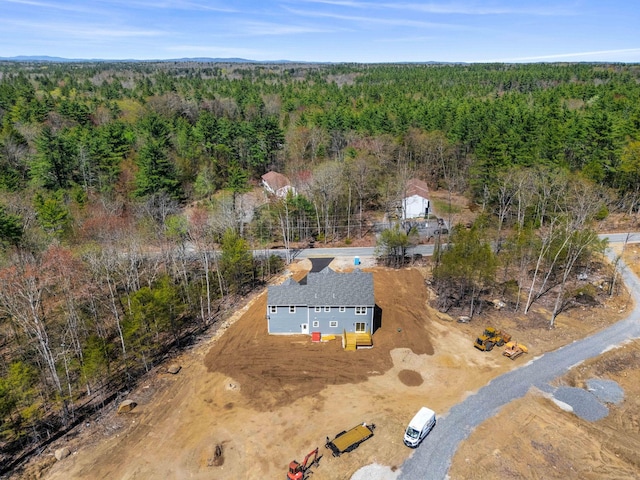 aerial view featuring a view of trees