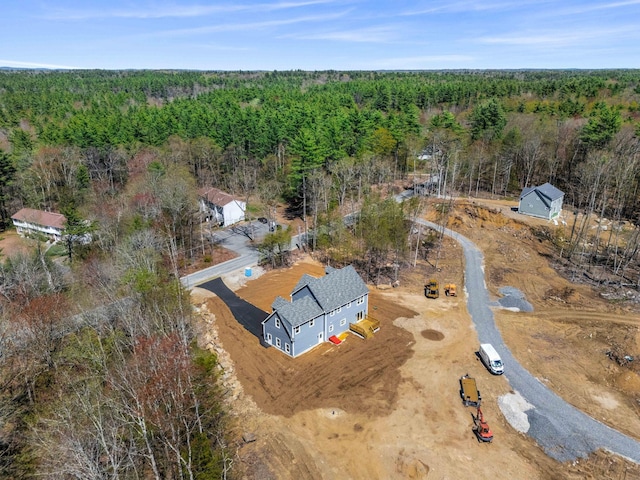 drone / aerial view with a view of trees
