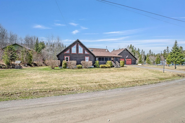 log-style house featuring an attached garage, driveway, and a front lawn