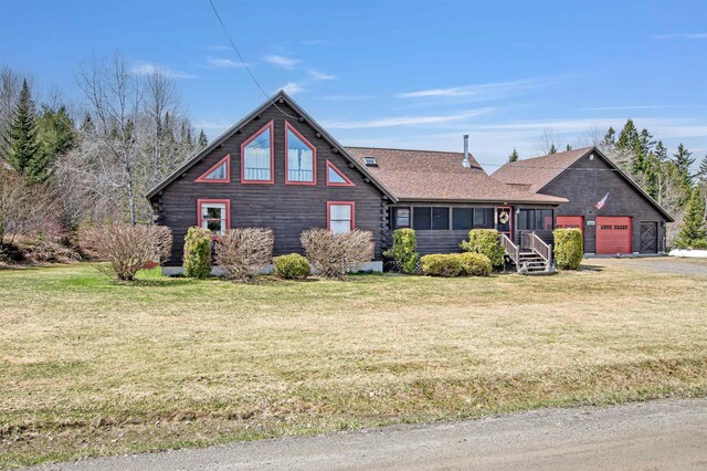 log cabin featuring a front lawn and roof with shingles