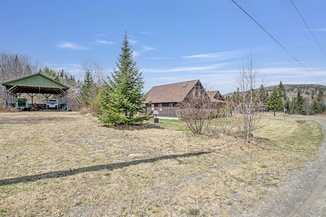 view of yard with a carport