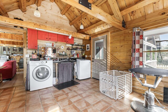 laundry room featuring washer / clothes dryer, wood walls, wooden ceiling, and light tile patterned floors