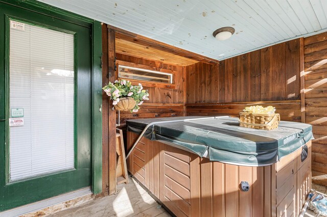 miscellaneous room featuring wooden walls and wood ceiling