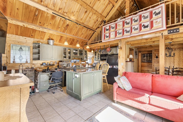 kitchen featuring wooden walls, light tile patterned flooring, black appliances, and wooden ceiling