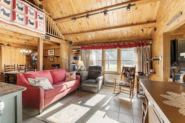 living area with wood walls, wooden ceiling, track lighting, a notable chandelier, and vaulted ceiling with beams