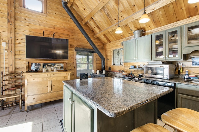 kitchen featuring wood ceiling, light tile patterned floors, stainless steel microwave, beamed ceiling, and wooden walls